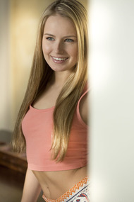 Playful blonde Scarlett Sage has a smile