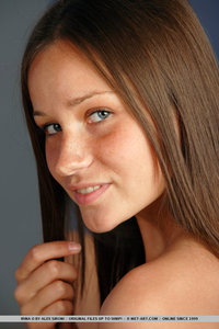 Teen brunette spreads her pussy