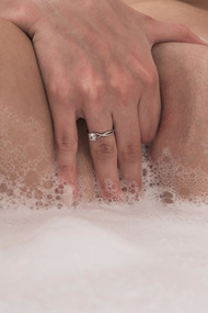 Gorgeous Hayli Sanders takes off her pretty dress and heels, admiring her sexy body in the mirror before climbing into the batht