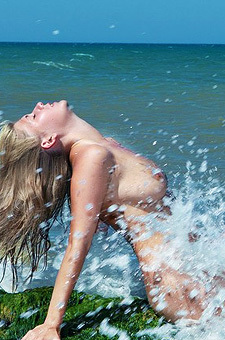 Busty April Nude By The Sea